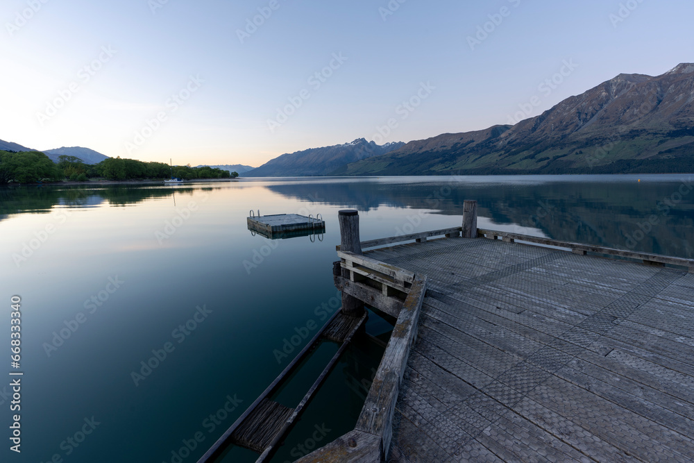 New Zealand landscape in Glenorchy near Queenstown with mountains and lake at sunrise