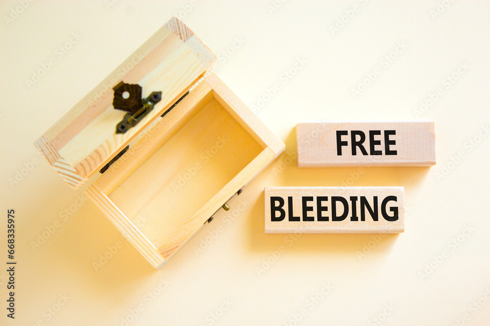Free bleeding symbol. Concept words Free bleeding on beautiful wooden block. Beautiful white table white background. Empty wooden chest. Gen Z, motivational freedom free bleeding concept. Copy space. Free bleeding symbol. Concept words Free bleeding on beautiful wooden block. Beautiful white table white background. Empty wooden chest. Gen Z, motivational freedom free bleeding concept. Copy space.