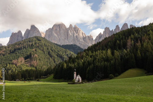 Church of St. Johann, Dolomites backdrop.