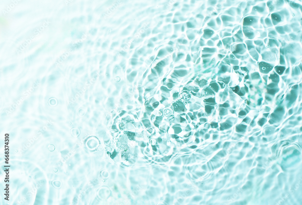 Transparent sunny blue water surface texture background.