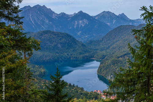 Turquoise lake in mountains Bavarian Alps on foggy morning. Ski resort in auttumn.
