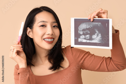 Young Asian woman with preg...