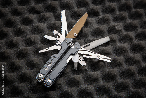 Modern universal army multitool. A tool for all occasions. Gray foam back
