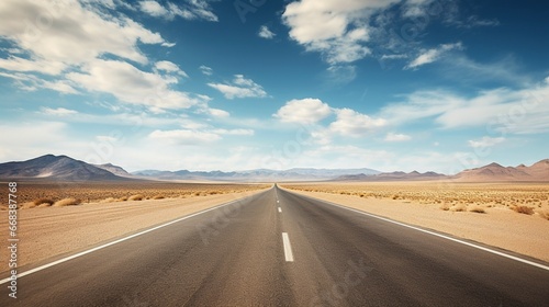 A vast and empty highway stretching to the horizon through an arid desert. © Muslim