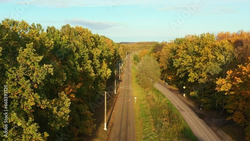Railway through autumn forest. Aerial view from drone photo