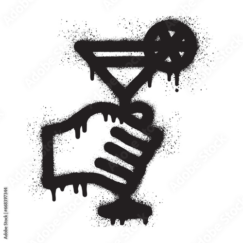 Graffiti of a hand holding cocktail glass with black spray paint