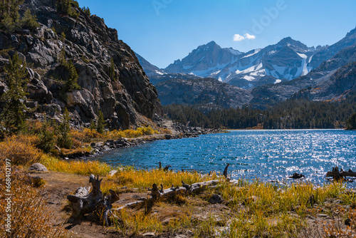 Hiking in Little Lakes Valley in the Eastern Sierra Nevada Mountains outside of Bishop  California. Alpine lakes  fall leaf colors  snow capped mountains and evergreen trees combine to make a pictures