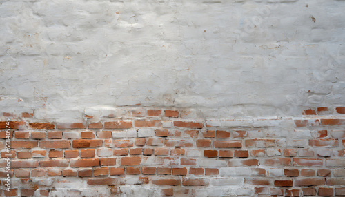 brick wall texture with white shabby stucco plaster red and white brickwall background white stonewall surface plastered wall with white uneven stucco with cracks and damages photo
