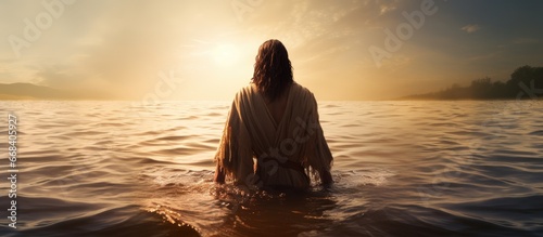 Photographie Sunlit water with Jesus Christ seen from behind