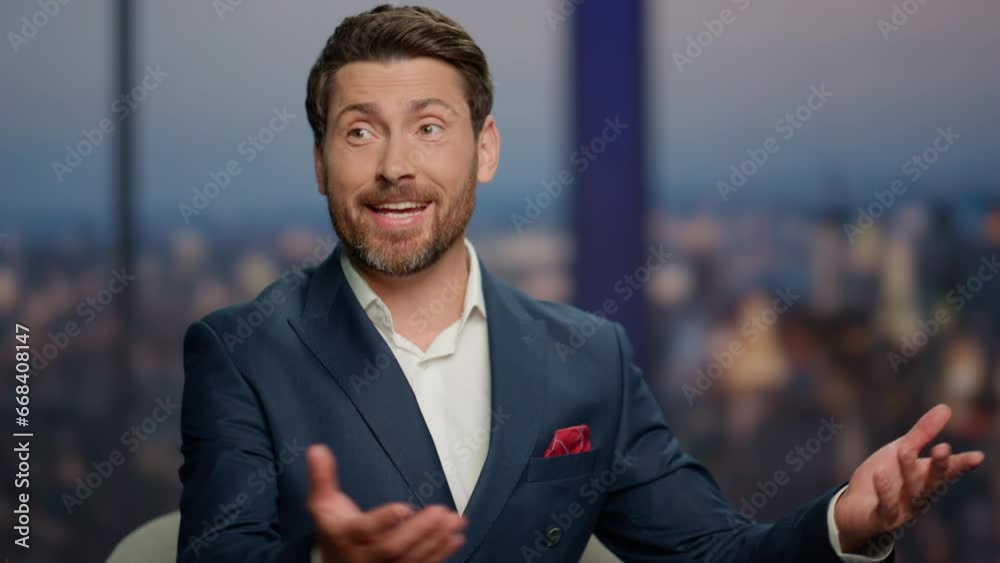 Smiling program guest talking to unknown presenter in studio channel close up.