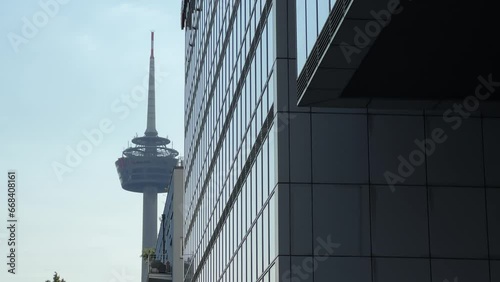 Cinematic shot of Fernsehturm tv tower and Mediapark skyscraper glass building in Cologne, Germany photo