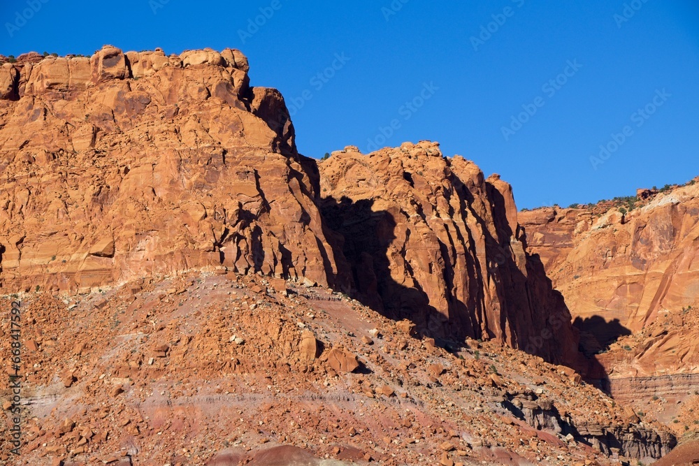 A drive through the northern edge of Capitol Reef National Park brings you along a winding surrounded by steep, beautiful red rock walls