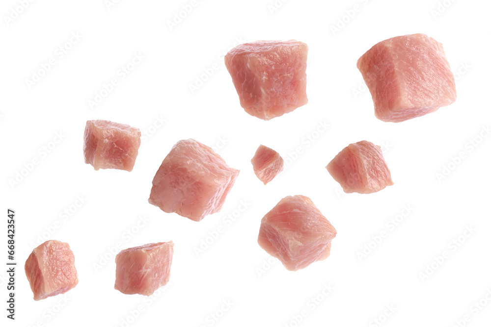 Pieces of raw pork for goulash flying on white background Pieces of raw pork for goulash flying on white background