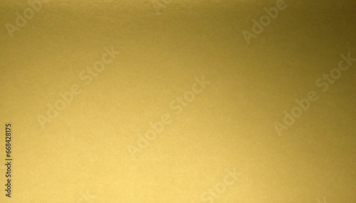 A luxurious golden background material. Textured gold gradient background material.