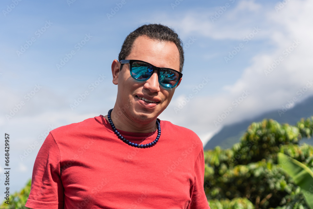 Latin man with sunglasses and the mountain in the background. Latin man with sunglasses and the mountain in the background.
