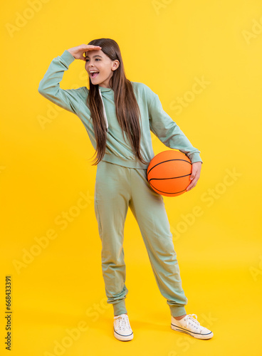 basketball in childhood. Learning skills of basketball at teen girl childhood. Childhood memories of basketball. teen girl childhood with basketball. teen girl play with ball. sports achievements photo