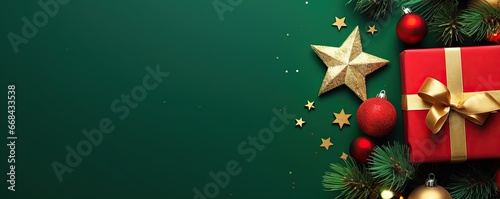Christmas day decoration, christmas red gift box with decoration stars and light on green background, copy space banner photo