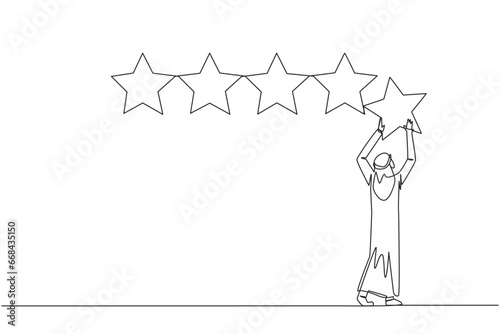 Single continuous line drawing young Arabian man holding up a star with both hands and pasting it up to make 5 stars in a row. Give the best review. Online shop. One line design vector illustration © Simple Line
