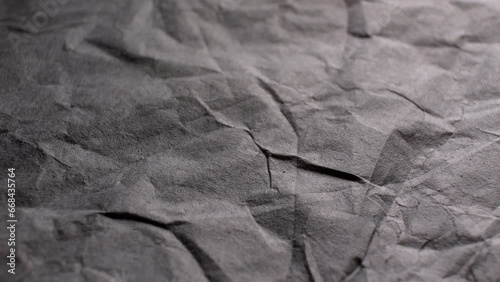 CRUMPLED paper texture in gray tones with soft shadows. Ideal for backgrounds, design projects or presentations.
