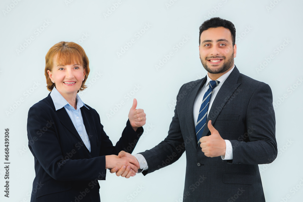 business man and business woman shaking hands in the office business man and business woman shaking hands in the office