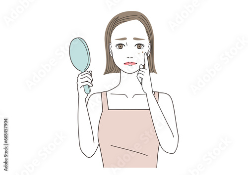 頬にできたシミを気にしている女性