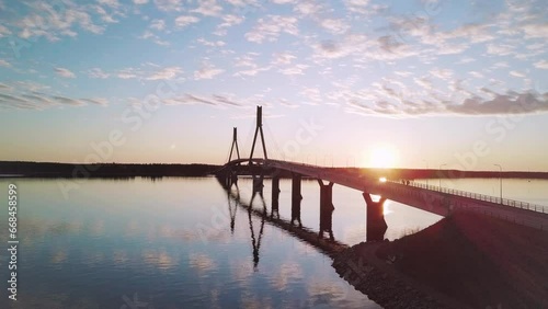 Wallpaper Mural Aerial Orbiting shot Car crossing Replot Bridge during sunset with Mirror reflection on Water, Finland Torontodigital.ca