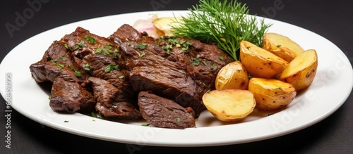 Plate with fried liver and boiled potatoes