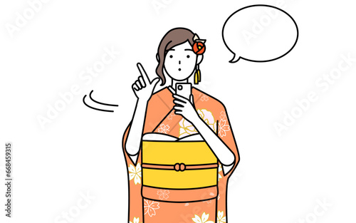 Hatsumode at New Year's and coming-of-age ceremonies, graduation ceremonies, weddings, etc, Woman in furisode operating a smartphone.