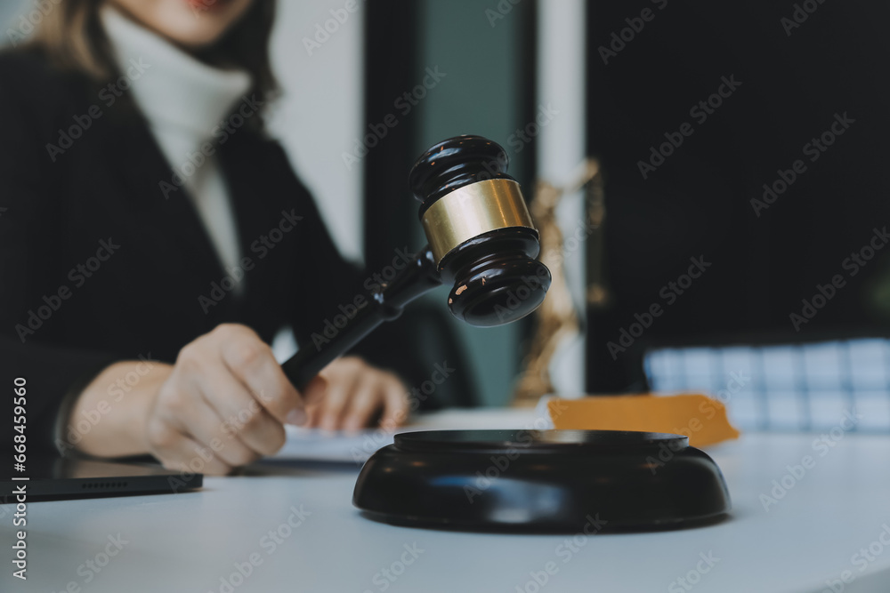 Judge gavel with Justice lawyers having team meeting at law firm in background. Concepts of law. Judge gavel with Justice lawyers having team meeting at law firm in background. Concepts of law.