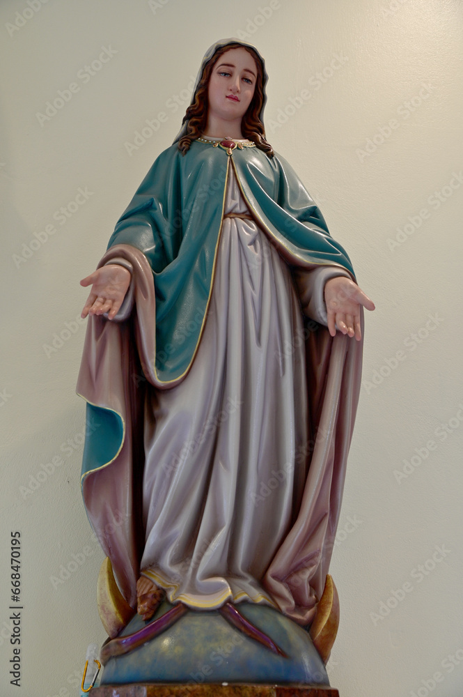 Close-up of Beautiful Statue of Our lady of grace virgin Mary located in the church, Thailand. selective focus. Close-up of Beautiful Statue of Our lady of grace virgin Mary located in the church, Thailand. selective focus.