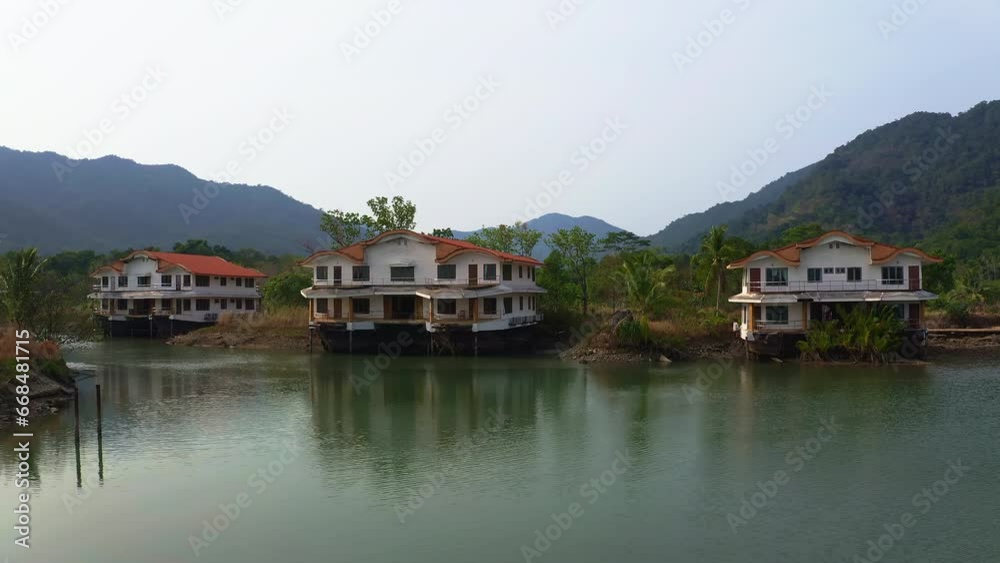 Decaying overwater bungalows on stilts in abandoned Koh Chang resort. Decaying overwater bungalows on stilts in abandoned Koh Chang resort.