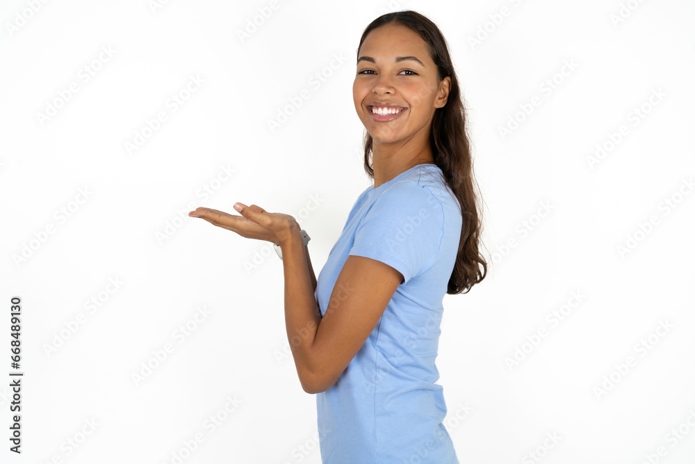 Young beautiful woman pointing aside with hands open palms showing copy space, presenting advertisement smiling excited happy Young beautiful woman pointing aside with hands open palms showing copy space, presenting advertisement smiling excited happy