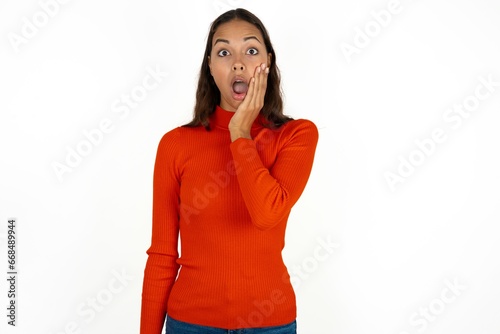 Shocked Young beautiful woman looks with great surprisment being very stunned, astonished with unexpected news, Facial expressions concept. photo