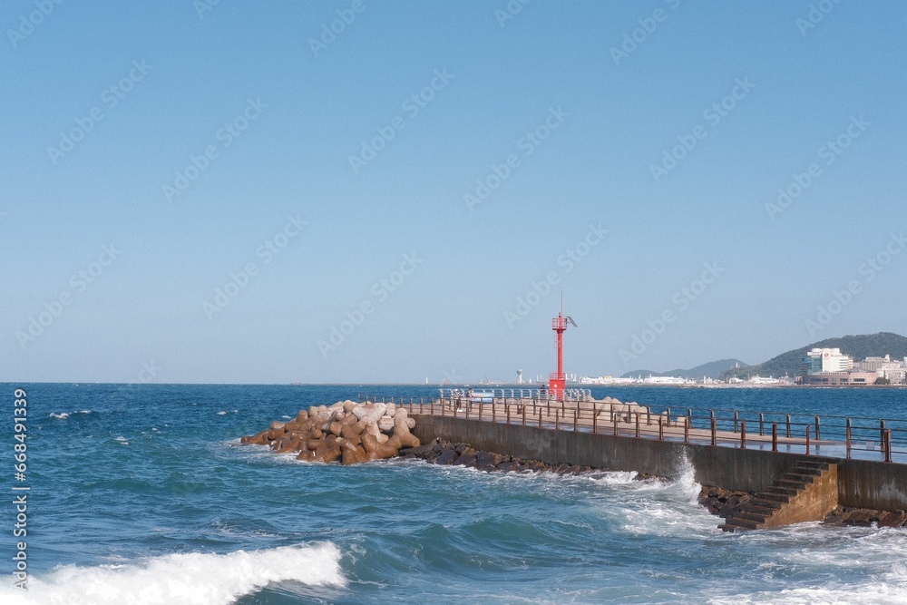 Majestic, iconic lighthouse on the coast of Jeju Island, South Korea