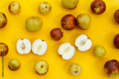 Fresh jujube fruit on yellow background