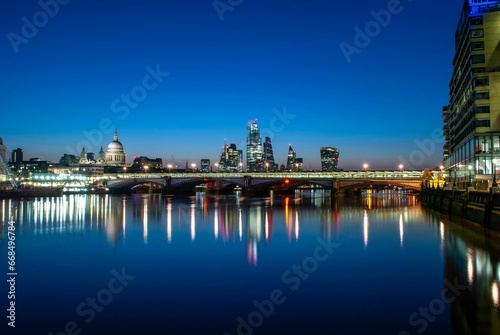 Beautiful view of London  England from the banks of the River Thames during the blue hour