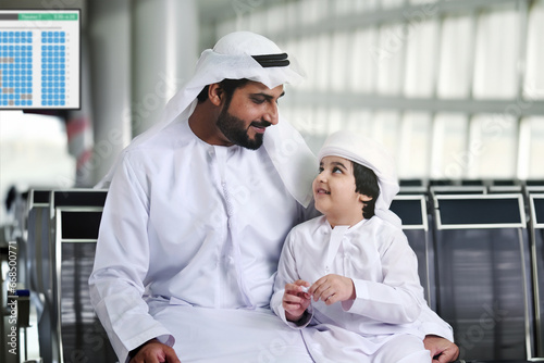 Photography Middle Eastern Arab family father and son at airport travelling for holiday season concept