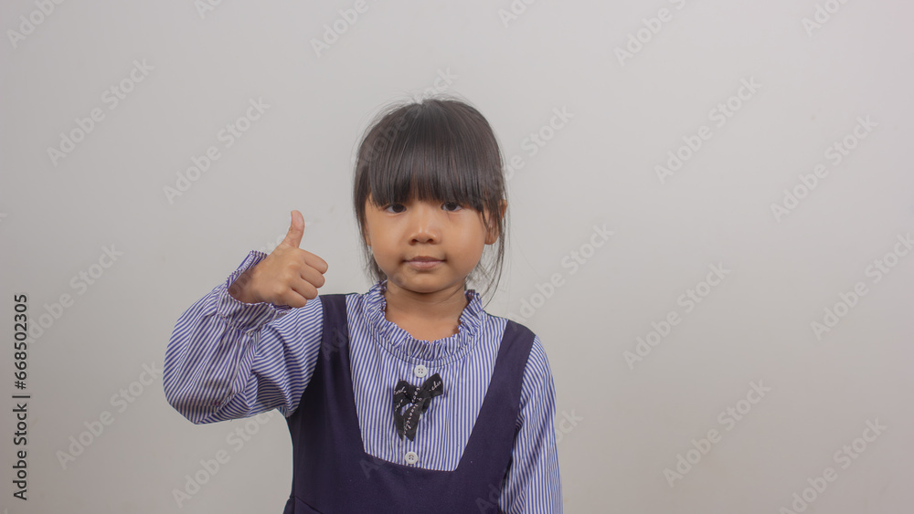 Photo of happy charming nice little girl winner raise fists smile Photo of happy charming nice little girl winner raise fists smile