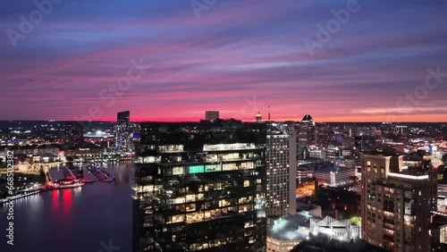 Aerial footage of the cityscape of Baltimore at night in Maryland, United States