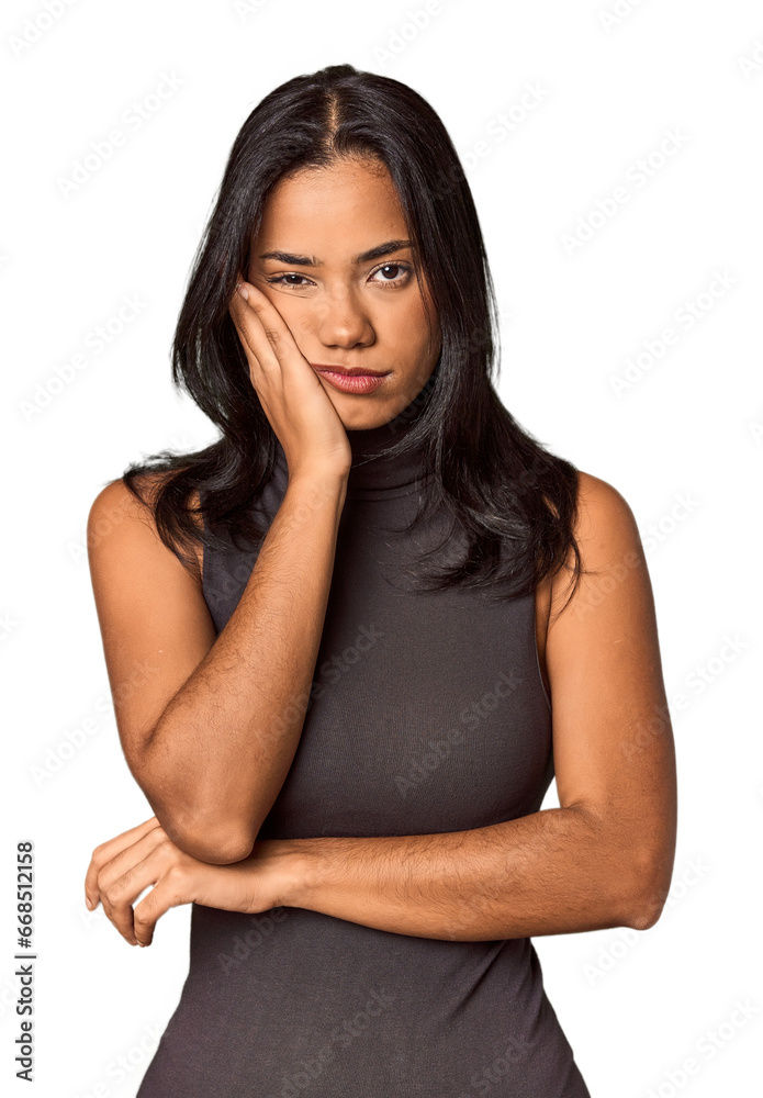 Young Filipina with long black hair in studio who is bored, fatigued and need a relax day. Young Filipina with long black hair in studio who is bored, fatigued and need a relax day.