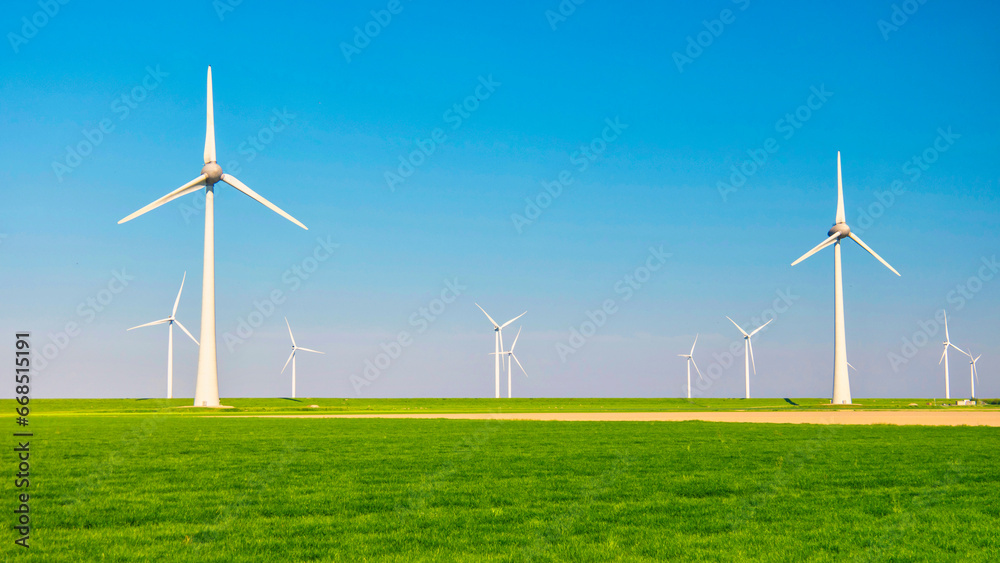 Windmill turbines at sea seen from a drone aerial view from above at a huge windmill park Windmill turbines at sea seen from a drone aerial view from above at a huge windmill park