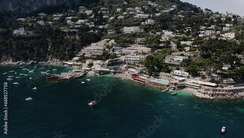 Aerial view of Capri, Italy's enticing waters with resorts lining the coast. photo
