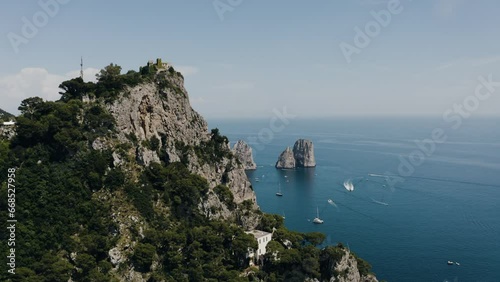Aerial view orbiting around Capri, Italy's Marina Grande mountain top. photo