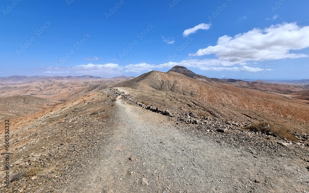 A gravel road through the wilderness on the Spanish island of Fuerteventura