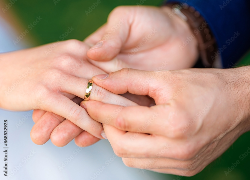 Young couple's hands with engagement rings Young couple's hands with engagement rings