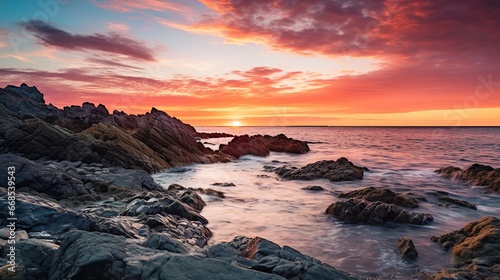 Fiery Sunset Over Rugged Coastal Cliffs