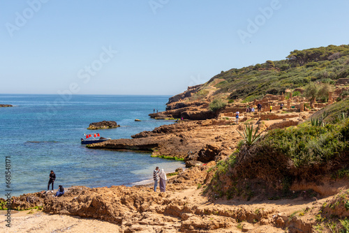 Tpaza, Tipasa, Algeria, 10 22 2023 : Ruins of the Roman Archeological Park of Tipaza. Tourists on the site. photo