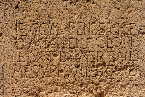 Detail of the emorial stone dedicated to the French writer Albert Camus, Tipaza, Tipasa, Algeria. Text : glory means to love unconditionnaly.