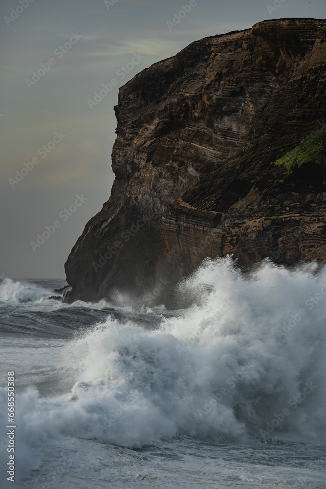 a man rides his surfboard near the water's edge a man rides his surfboard near the water's edge