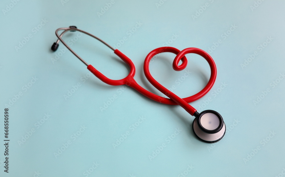 Red stethoscope with heart on blue modern background. Medical insurance concept Red stethoscope with heart on blue modern background. Medical insurance concept